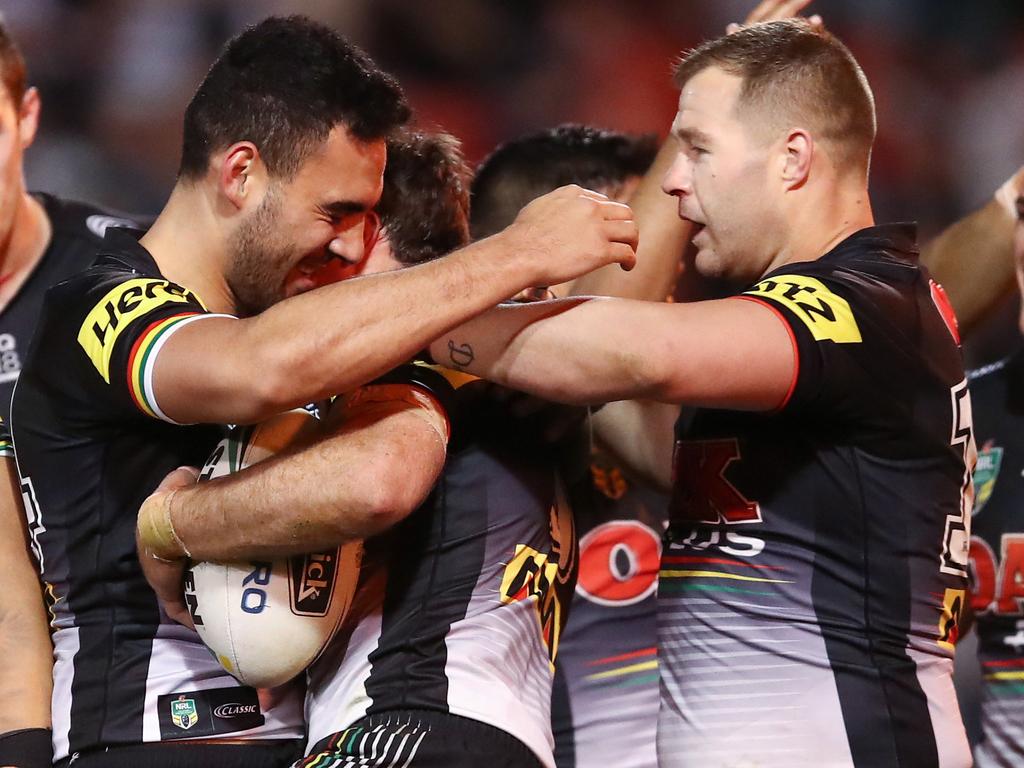 James Maloney of the Panthers celebrates with team mates after scoring a try during the Round 21 NRL match between the Penrith Panthers and the Canberra Raiders at Panthers Stadium in Sydney, Sunday, August 5, 2018. (AAP Image/Brendon Thorne) NO ARCHIVING, EDITORIAL USE ONLY