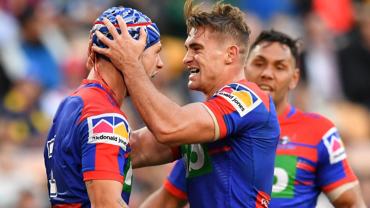 Kalyn Ponga (left) celebrates a try with Watson, who heads to the Sydney Roosters next season.