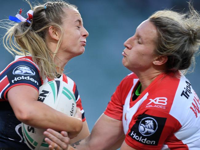 Brydie Parker of the Roosters (left) is tackled by Holli Wheeler of the Dragons during the NRL Women's Premiership match between the Sydney Roosters and the St George-Illawarra Dragons at Allianz Stadium in Sydney, Saturday, September 22, 2018. (AAP Image/Dan Himbrechts) NO ARCHIVING, EDITORIAL USE ONLY