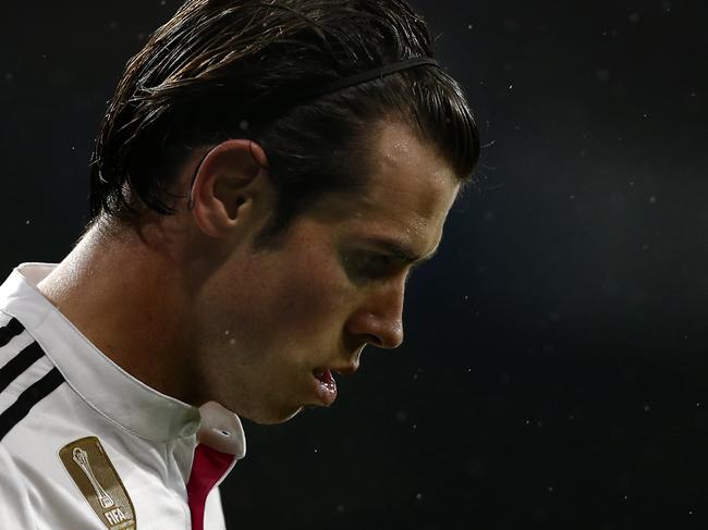 Real Madrid's Gareth Bale from Britain reacts during a King's Cup soccer match between Atletico de Madrid and Real Madrid a at the Santiago Bernabeu stadium in Madrid, Spain, Thursday, Jan. 15, 2015. (AP Photo/Daniel Ochoa de Olza)