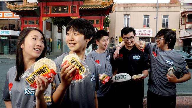 Chinese students Ying Zhou, Jo Huang, Ninghuai Wu, Jinsong Li and Yisu Wang on Gouger St with Four ‘N Twenty Pies. Picture: Calum Robertson