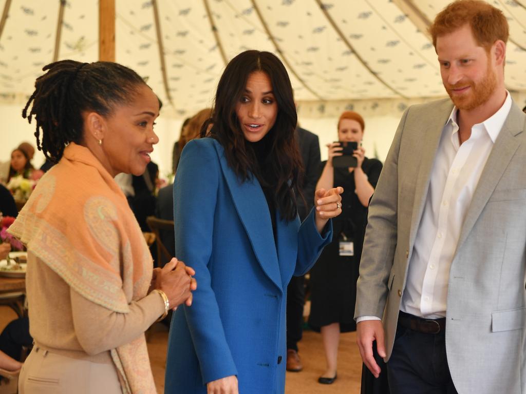 Meghan with her mother Doria Ragland and Prince Harry at last week’s  launch of a cookbook with recipes from a group of women affected by the Grenfell Tower fire.