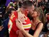 Taylor and Travis pack on PDA after Super Bowl win
