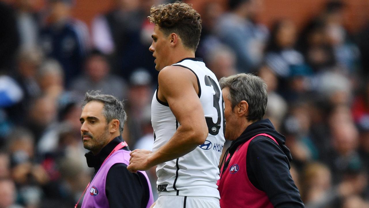 Charlie Curnow had to be helped from the field on Saturday. Picture: AAP Images 