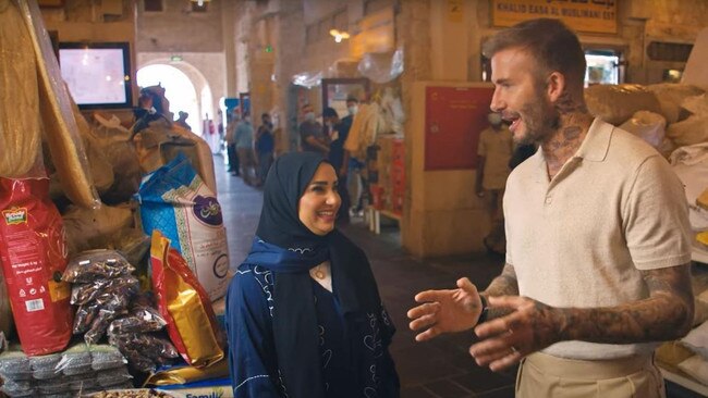 Beckham meets locals in a Doha spice market as part of the video. Picture: YouTube