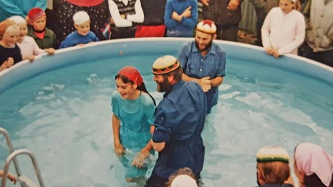 Serafina Tane being baptised at Camp David in New Zealand.