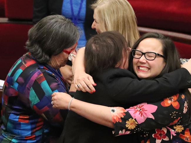 MELBOURNE, AUSTRALIA - NOVEMBER 22:  Jaala Pulford is congratulated by Harriet Shing MP and Fiona Patten MP as the bill passes inside of the Parliament of Victoria after the Upper House voted to pass historic euthanasia laws on November 22, 2017 in Melbourne, Australia. After a marathon 28-hour special sitting, the upper house members voted to pass the historic laws 22 votes to 18. Victoria will be the first state in Australia to offer an assisted dying regime.  (Photo by Scott Barbour/Getty Images)