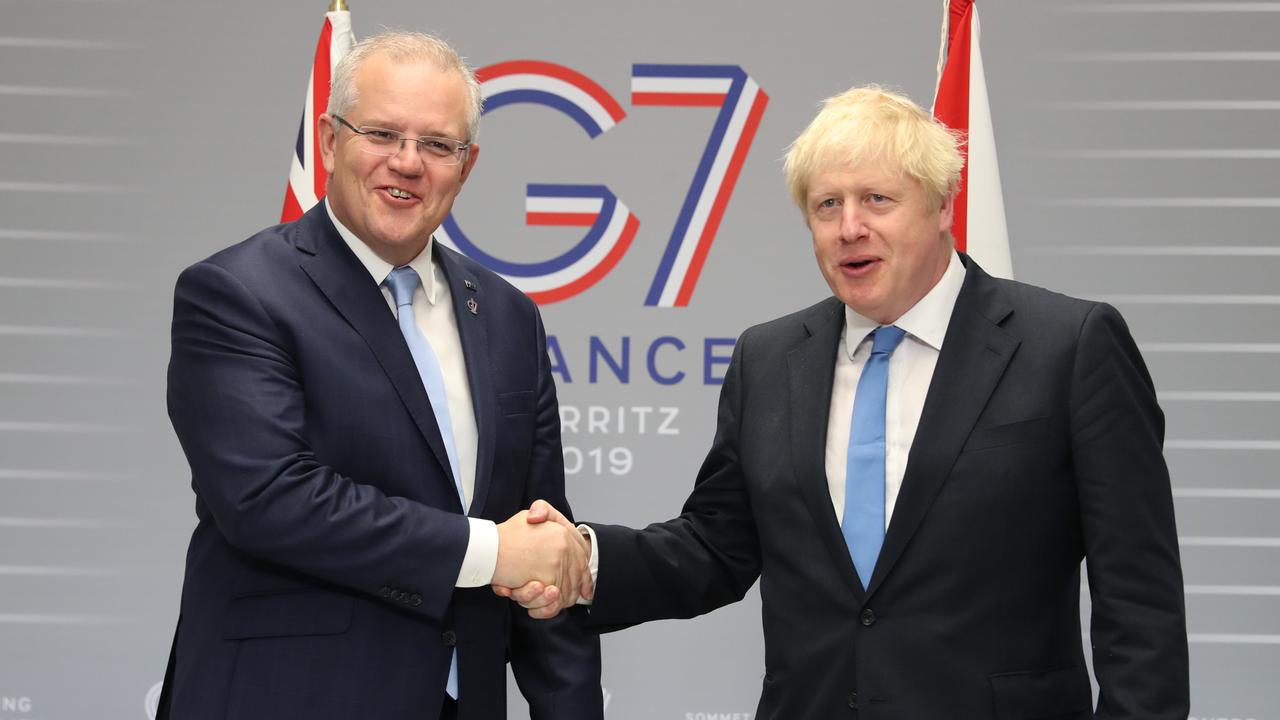 Prime Minister Scott Morrison and UK Prime Minister Boris Johnson in pre-COVID times sharing a handshake. Picture: Adam Taylor/PMO