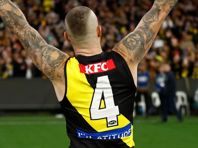 MELBOURNE, AUSTRALIA - JUNE 15: Dustin Martin of the Tigers recognises the crowd after his 300th match during the 2024 AFL Round 14 match between the Richmond Tigers and the Hawthorn Hawks at The Melbourne Cricket Ground on June 15, 2024 in Melbourne, Australia. (Photo by Michael Willson/AFL Photos via Getty Images)