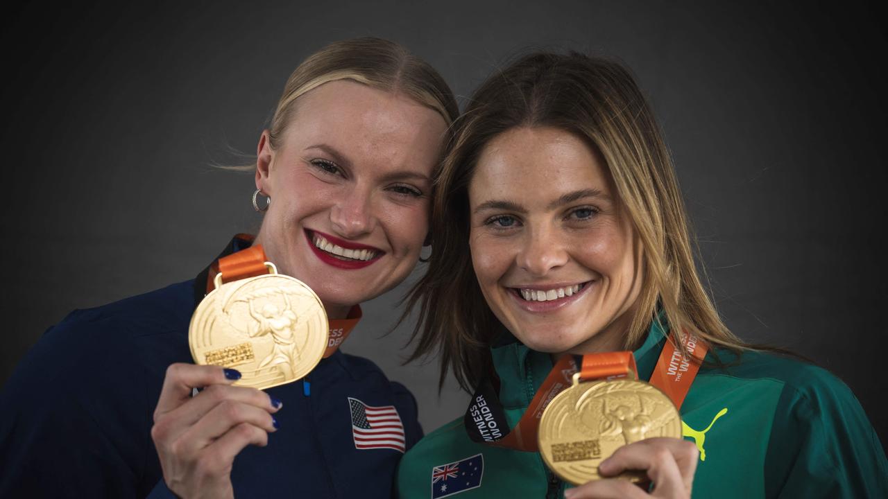 Moon and Kennedy showing off their shared golds. (Photo by ANDREJ ISAKOVIC / AFP)