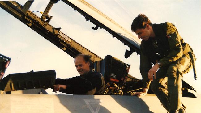 John Riddell in a military aircraft.