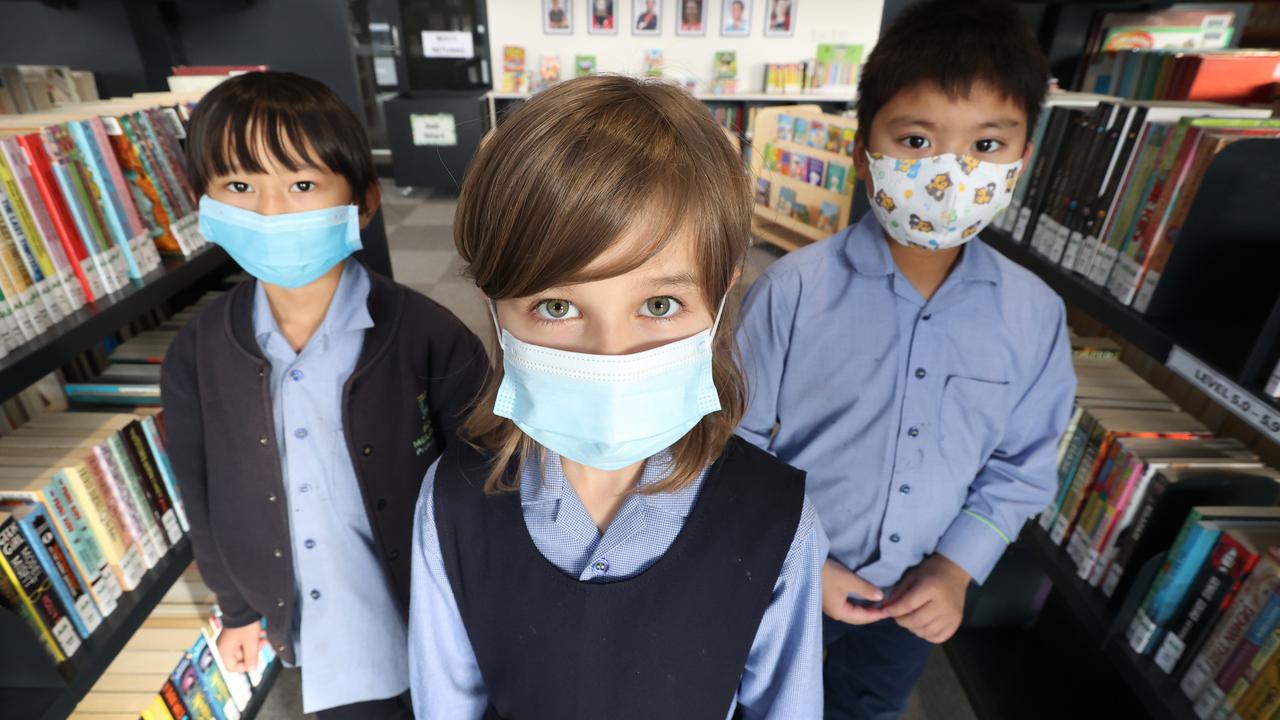 South Melbourne Primary students wear in masks in the school library. Picture: David Caird