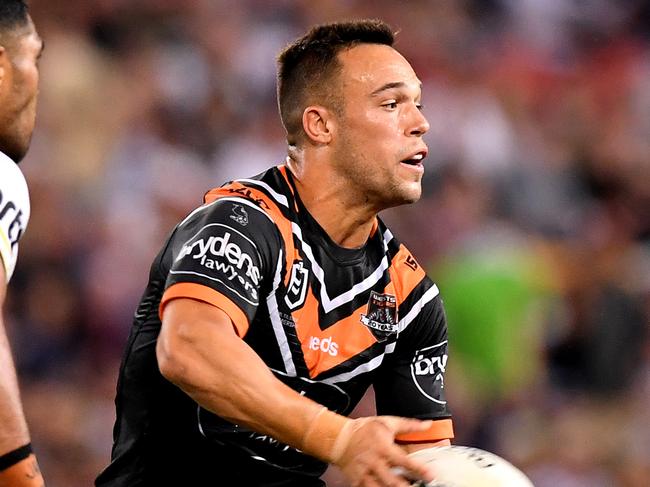 BRISBANE, AUSTRALIA - MAY 10: Luke Brooks of the Tigers passes the ball during the round nine NRL match between the Wests Tigers and the Penrith Panthers at Suncorp Stadium on May 10, 2019 in Brisbane, Australia. (Photo by Bradley Kanaris/Getty Images)