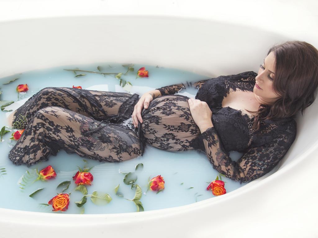 Melinda Manning poses in a milk bath. Picture: Shannon Smith