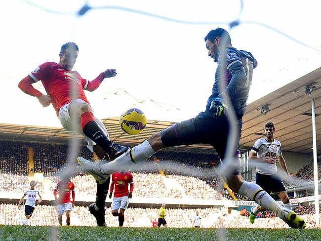 Robin van Persie of Manchester United has his attempt on goal saved by Hugo Lloris.