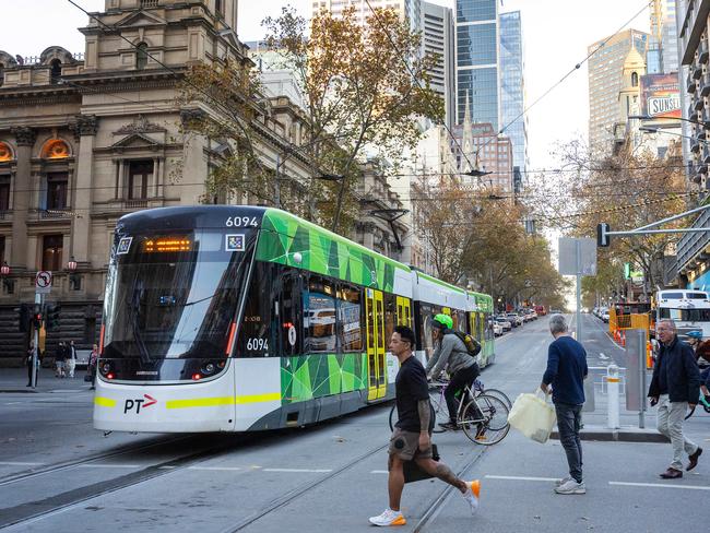 MELBOURNE, MAY 28, 2024: Street scene recreations - Looking east along Collins Street, Melbourne Town Hall at left of frame. Picture: Mark Stewart