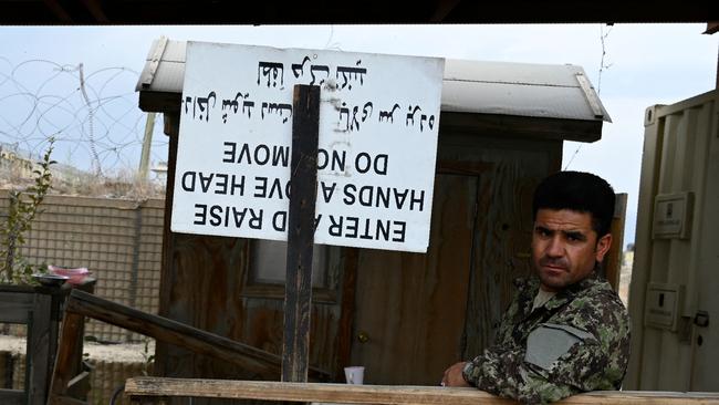 An Afghan National Army (ANA) soldier stand guard inside the Bagram US air base after all US and NATO troops left, some 70 Kms north of Kabul on July 5, 2021. (Photo by WAKIL KOHSAR / AFP)