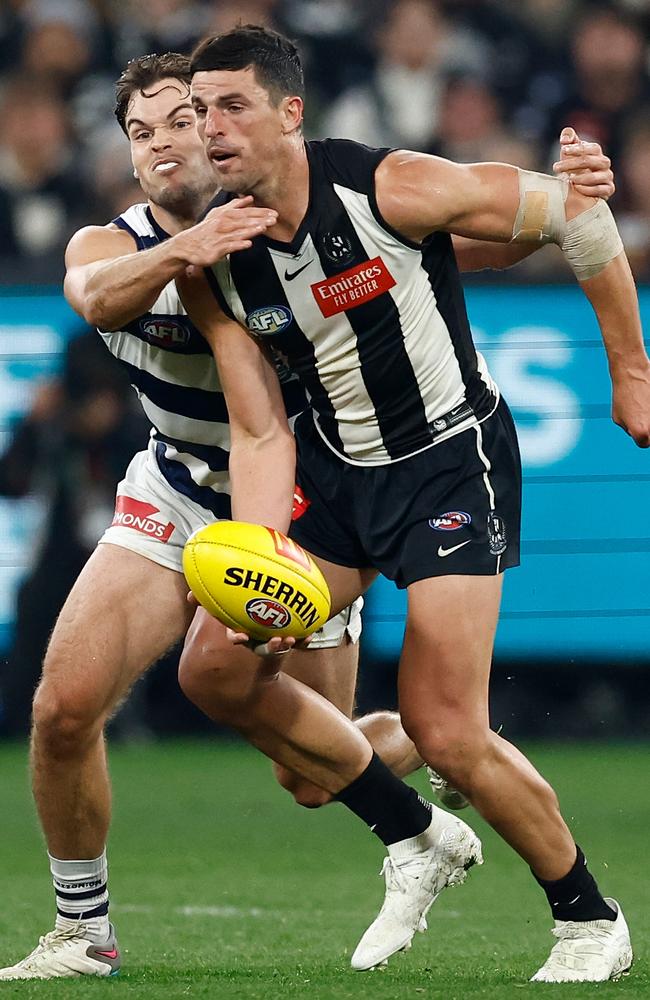 Cat Jack Bowes catches Scott Pendlebury on Friday night. Picture: Michael Willson/AFL Photos