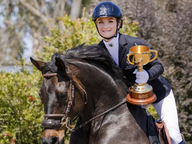 PLEASE DO NOT RUN BEFORE MONDAY OCT 24, 2022, Jamie Kah with her retired racehorse, Brax, and the Lexus Melbourne Cup at her Mornington Peninsula farm. Picture: Nicole Cleary.