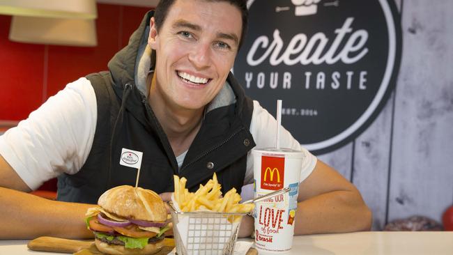 Macarthur Chronicle - Pictured: Josh Webster (25) with a custom made burger (breakfast announcer at C91.3 FM) - Woodbine MacDonalds unveiled their gourmet burger menu today along with digital ordering systems. All photographs taken in store, Harbord Road, Woodbine NSW Australia
