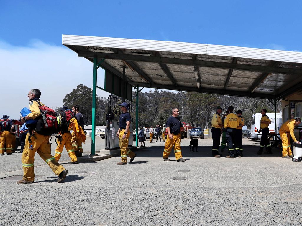 Personnel from the ACT Rural Fire Service head out from The Great Lakes store to the fire front near Miena. Picture: LUKE BOWDEN