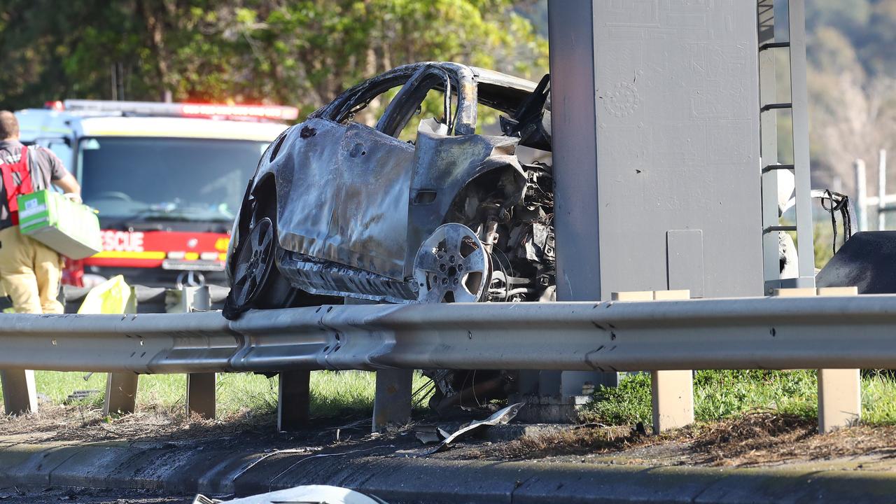 The car burst into flames following impact. Picture: Alison Wynd.