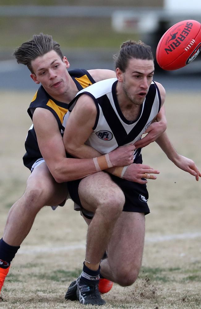 Liam Byrne gets wrapped up during Bundoora’s victory over Whittlesea on Saturday.