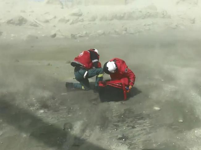 Rescuers arrive on White Island after the volcano erupted. Picture: Auckland Rescue Helicopter Trust