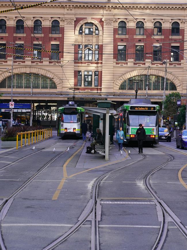 The iconic corner at the heart of Melbourne CBD is now littered with electric scooters and homeless and anti-social people. Picture: Luis Enrique Ascui