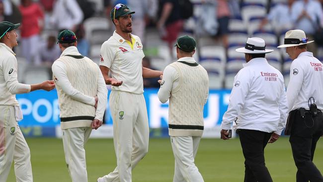 Mitchell Starc talks to the umpire after the decision went against Australia. Picture: Getty Images