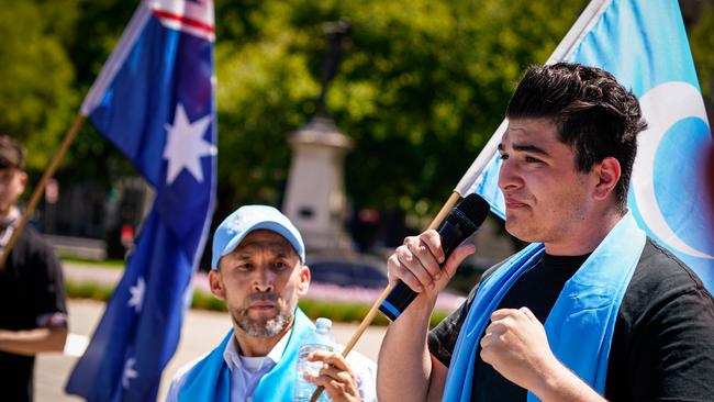 Student activist Drew Pavlou, right, joins rallying Uighurs at Adelaide’s Victoria Square in February. Picture: Mike Burton