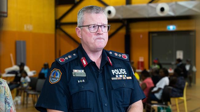 NT Police Commissioner Jamie Chalker has provided evacuees at the Howard Springs facility with photos of their flood-impacted houses and communities. Picture: Pema Tamang