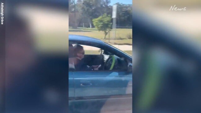 Woman caught using her phone while driving children