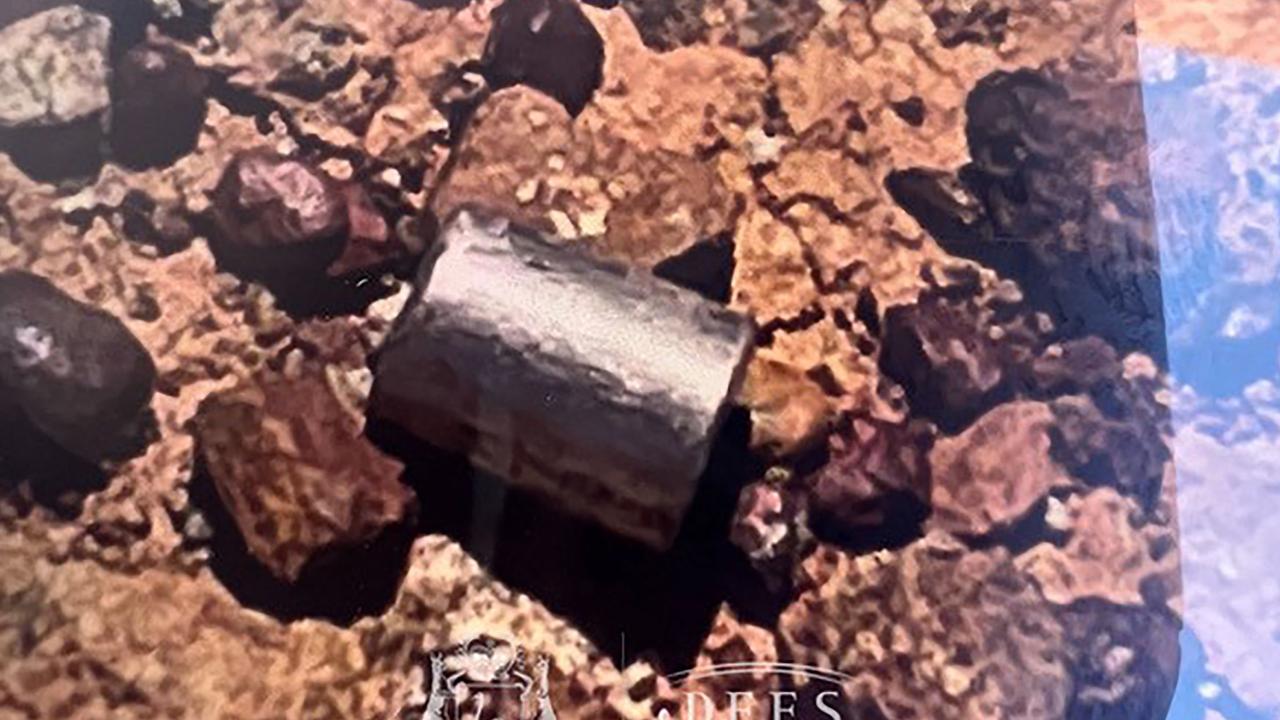 A radioactive capsule, which had fallen off a truck, after it was found along a desert highway south of Newman, Western Australia. Picture: AFP