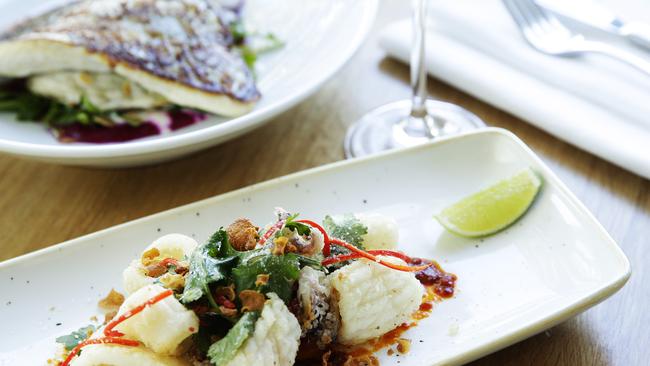 Salt and pepper squid (front) with mirror dory and rocket, roast fennel and beetroot puree with almond flakes and feta dressing. Picture: Braden Fastier