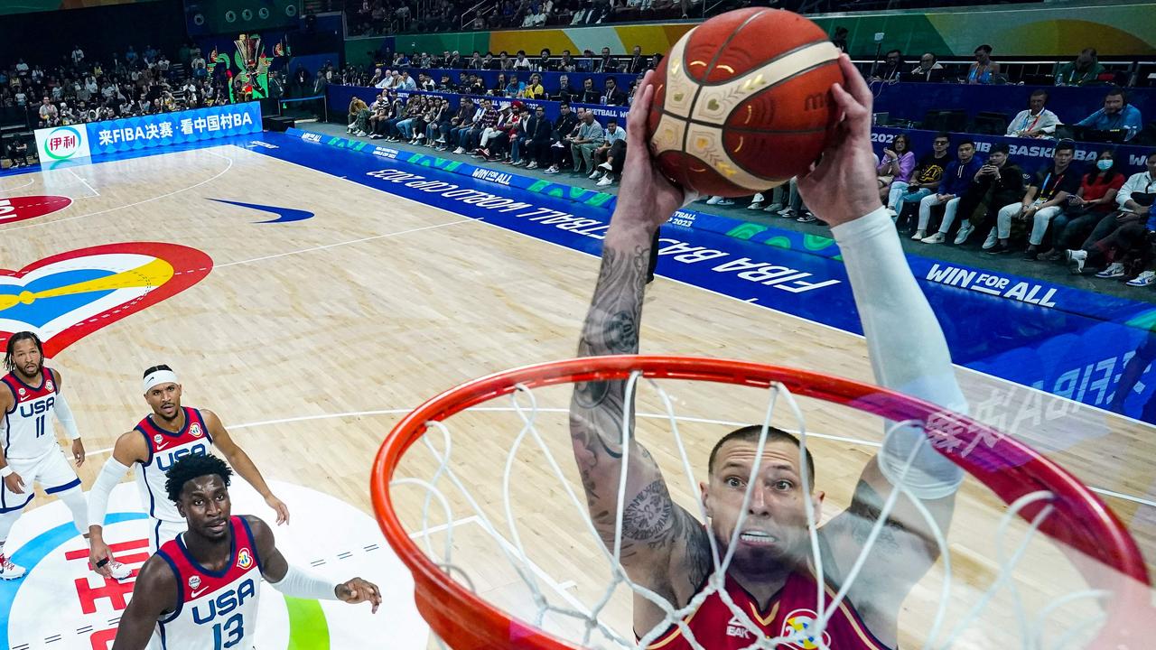 Daniel Theis #10 of Germany dunks the ball past Jaren Jackson Jr. #13 of the United States in the first half during the FIBA Basketball World Cup semifinal. Picture: AFP.