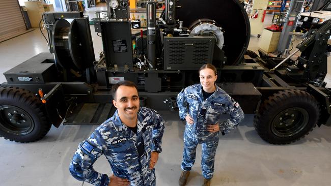 Different elements of 27 Squadron at RAAF Base Townsville ready for Exercise Crimson Dawn. Aircraftsman Benjamin Kohl and Leading Aircraftswoman Jaz Byrnes with on the the unit's mobile arrester units. Picture: Evan Morgan