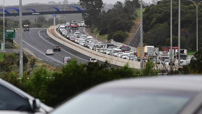 There have been major traffic delays all morning after a cement truck rolled over on the Southern Expressway. Picture: AAP/Mark Brake