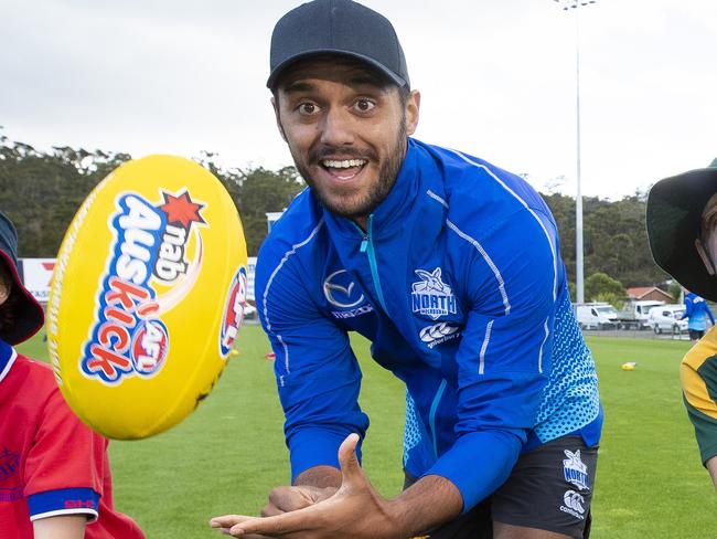 North Melbourne in town for their AFL Community Camp. Tassie Kangaroo Aaron Hall with Jasper Delaney 8 Sacred Heart College,  Poppy Wilson, 9 New Town Primary School and Oscar Ladd 9 Immaculate Heart of Mary Catholic School. Picture: RICHARD JUPE