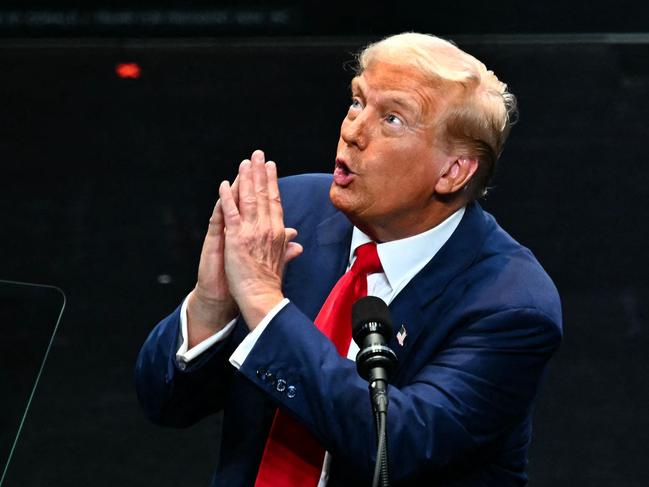 TOPSHOT - Former US President and Republican presidential candidate Donald Trump gestures while speaking during a campaign rally at Johnny Mercer Theatre Civic Center in Savannah, Georgia, on September 24, 2024. (Photo by CHANDAN KHANNA / AFP)