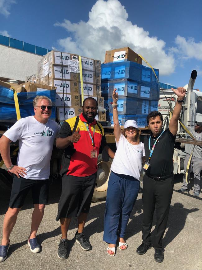 Alethea Gold in the Bahamas post Hurricane Dorian accepting delivery of aid from China, Germany and California via DHL. “DHL has supported my SmartAID missions around the world,” says Alethea. “They have just delivered PPE equipment to four of the largest hospital in Sydney. Picture: Supplied