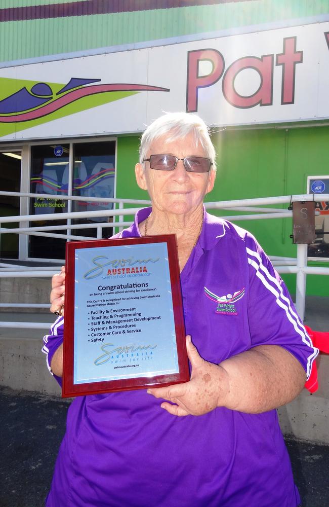 Pat Wright with her Swimming Australia accreditation, one of many awards and recognitions Wright has received over her illustrious career. Picture: Pat Wright Swim School