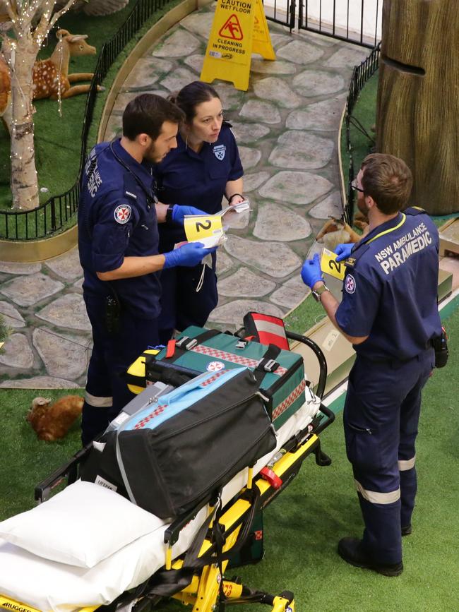 Paramedics at the scene last night. Picture: Bill Hearne