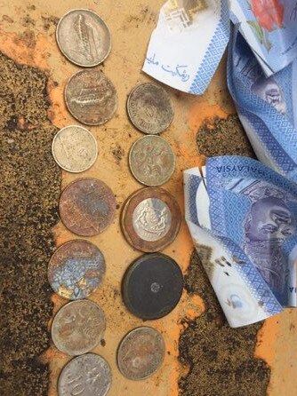 Australian and Malaysian money was found among the items on a Penang construction site. Picture: Supplied