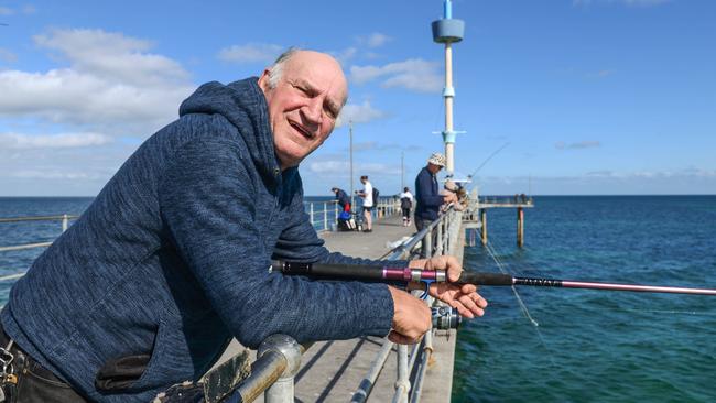 Boothby voter Henry Quaziz of Oaklands Park, drops a line from Brighton Jetty. Picture: Brenton Edwards