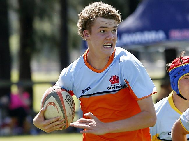 Hamish Bull from U15 Gavin gets away with the ball. U15 Gavin (Orange) v U15 Waugh (Yellow).  Rugby Union Next Gen Cup for Under 15s and U14s. Picture: John Appleyard