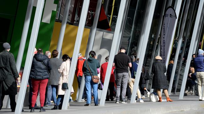 Melburnians queue for the vaccine at the Melbourne Convention and Exhibition Centre. Picture: Andrew Henshaw