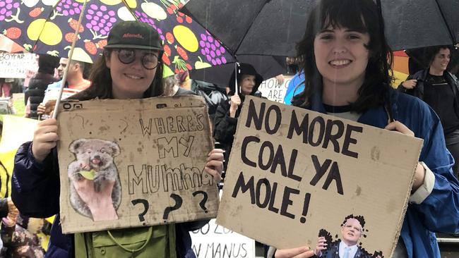 Climate change protesters Imogen and Marie during a rally in Melbourne on Friday night. Picture: Tessa Akerman