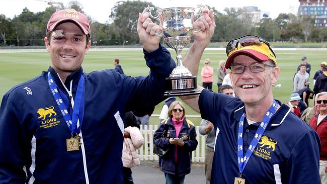 Fitzroy Doncaster’s Peter Dickson (L) and coach Mick O'Sullivan (R) lift the 2015-16 cup. Picture: Hamish Blair