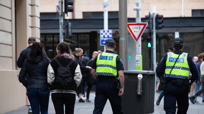 Police on Bank St near Hindley St. Authorities acted after a series of stories in The Advertiser highlighting the mounting issue. Picture: Brett Hartwig